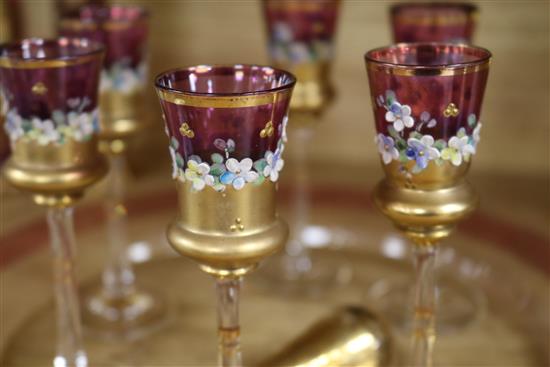 A Venetian ruby and gilt-painted liqueur set with a pair of matching vases and tray